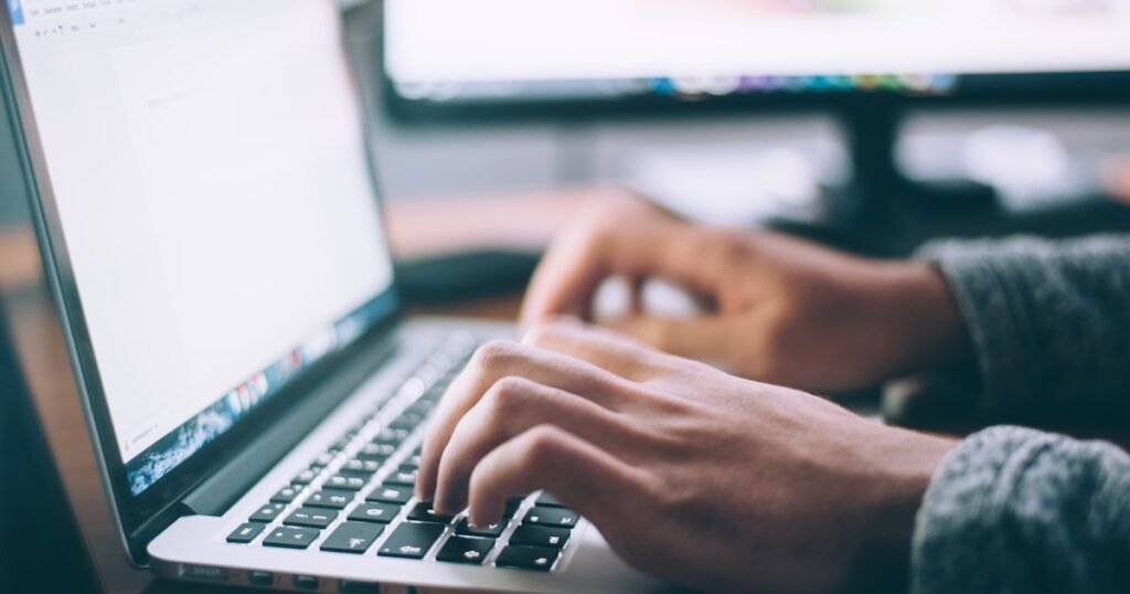 Person performing a technical SEO audit on a laptop
