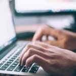 Person performing a technical SEO audit on a laptop